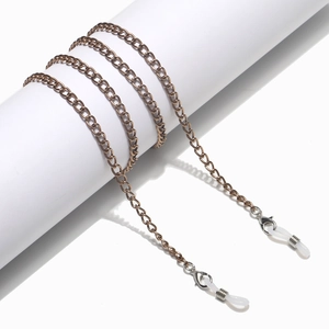 Close-up of bronze metal glasses chain with lobster clasps and silicone connectors