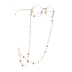 Golden round frame glasses with elegant pearl and seashell beaded eyewear chain
