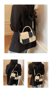 Detail of checkered PU leather handbag with thick handle and detachable shoulder strap