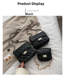 Three sizes of black quilted chain bags with gold square twist locks on a soft fabric