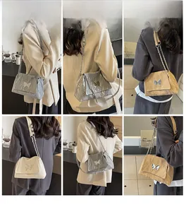 Detailed model views of fashionable pleated tote bags with metal butterfly and chain strap