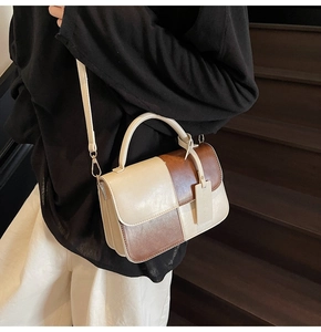 Chic two-tone checkered crossbody bag styled with a minimalist black and white outfit