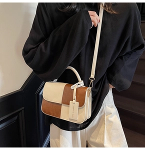 Detailed view of color-block crossbody bag on a model showing British style aesthetics