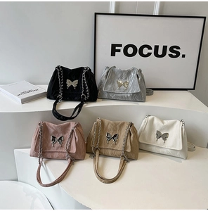 Chic tote bags in five colors with metallic butterfly buckles and chain straps