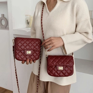 Burgundy quilted crossbody bag with gold chain strap and diamond pattern flap