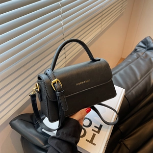Elegant black faux leather crossbody handbag with gold hardware and top handle strap