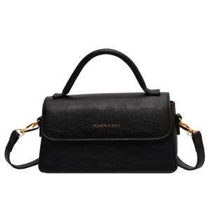 Classic black faux leather crossbody handbag with gold hardware and top handle for women