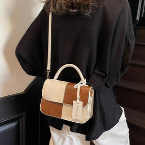 Minimalist cream and brown color-block crossbody handbag with adjustable shoulder strap