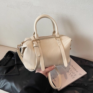 Chic pleated cream pillow bag with dual handles and gold-tone hardware for women