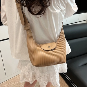 French style pleated hobo bag in light brown faux leather with a round metal buckle