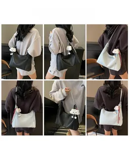Detailed views of hobo bag with metal chain strap and cute plush cloud pendant