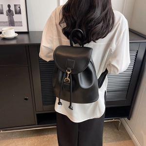 Large capacity black leather backpack for women with gold buckles and drawstring closure