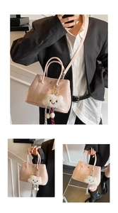 Pink patent leather handbag with cloud charm shown in multiple crossbody and hand-carried views