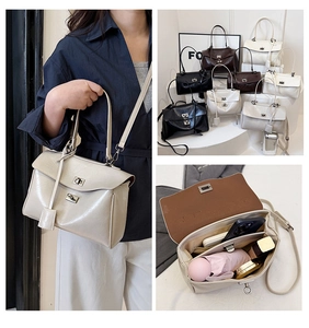 Macro detail of spacious interior storage and metal twist lock on women's handbag