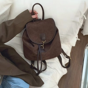 Minimalist vintage dark brown suede backpack with leather trim and gold buckle closure