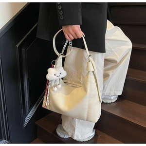 Off-white lychee texture hobo bag with metal chain detail and plush cloud charm