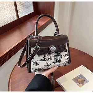 Close-up of vintage kerry bag showing the brown leather trim and artistic print detail