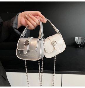 Detail showing silver and off-white mini square bags with chain straps and C buckle