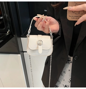 Detail of white mini crossbody bag with glossy leather and silver C-logo buckle