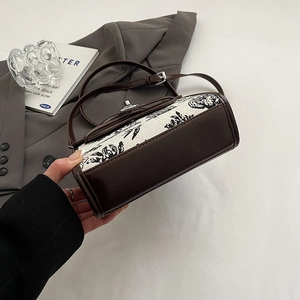 French retro shoulder bag with dark brown trim and Toile de Jouy print and metal lock