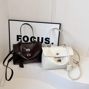 Chic high-capacity shoulder bags in coffee and cream faux leather for daily commuting
