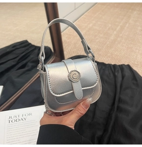 Detail of silver mini square bag with metallic finish and C-logo buckle