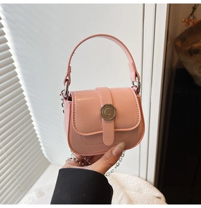 Detail of pink mini bag with silver C logo buckle and metallic chain strap