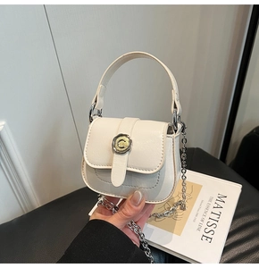 Detail of mini cream faux leather square bag with silver chain and C-logo buckle clasp