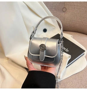 Detail of silver metallic textured mini bag with C-logo hardware and fine chain strap