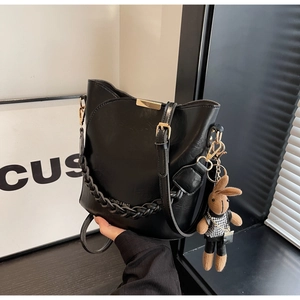 Retro black PU leather bucket bag with braided strap and cute rabbit pendant charm