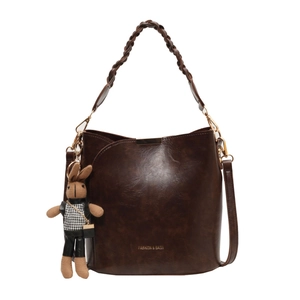 Vintage dark brown PU leather bucket bag with woven handle and bunny pendant