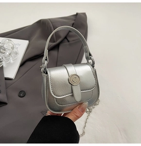 Detail of silver metallic mini handbag with pleated leather texture and C logo buckle