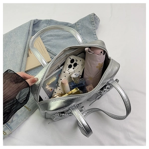 Large silver tote bag interior showing ample space for umbrella, phone, and makeup