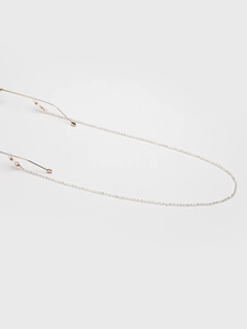 Detail of silver link eyewear chain with gold lobster clasps and clear silicone loops