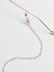 Macro detail of gold square crystal beads for eyewear chain with lobster clasp and silicone loop