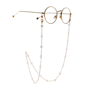 Golden round sunglasses with handmade square crystal beaded chain on white background