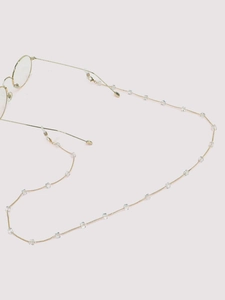 Detail of golden sunglasses chain with crystal cube beads and adjustable rubber loops