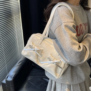 Large capacity off-white patent leather tote bag with bow detail and twin shoulder straps