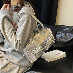 Silver metallic PU leather tote bag with pleated bow details and zipper closure