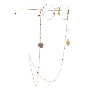 Golden eyewear chain with small white daisies and round beads on a metal link necklace
