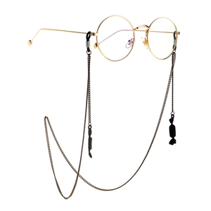 Gold metal round glasses with stylish black candy pendant chain strap on white background