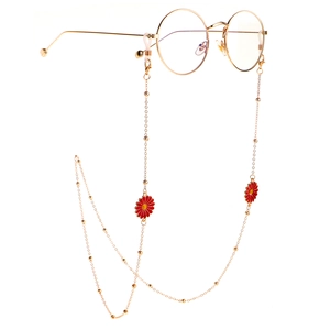 Golden metal eyewear chain with red daisy charms and vintage round frame glasses