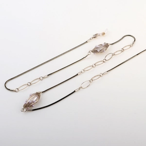 Chaîne de lunettes dorée avec perles en cage métallique et cordon tressé noir