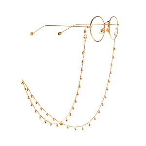Minimalist gold round metal glasses chain with small bead charms on a white background