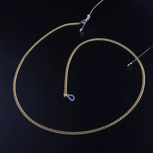 Golden metal eyewear chain with blue silicone loops on a black elegant curved background