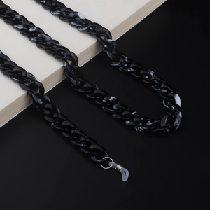 Detail of black and white marble pattern acrylic eyeglass chain with silicone loops