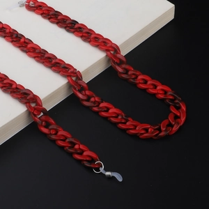 Detail of red and black marble pattern acrylic eyeglass chain with rubber loops