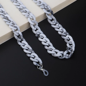 Macro shot of grey marble acrylic chain links with silver metal ring and silicone loop