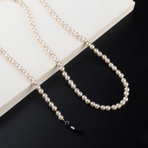 70cm pearl glasses chain with gold beads and black silicone loops on white background