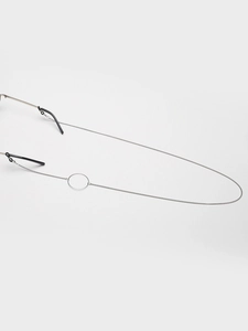 Detailed close-up of a silver stainless steel eyewear chain with a minimalist metal ring